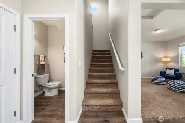 From the foyer easy access to the den/office, the stairs, 1/2 bath or open concept kitchen/ living room.
