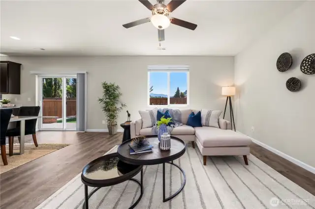Exit sliding glass doors to a private and tranquil backyard.