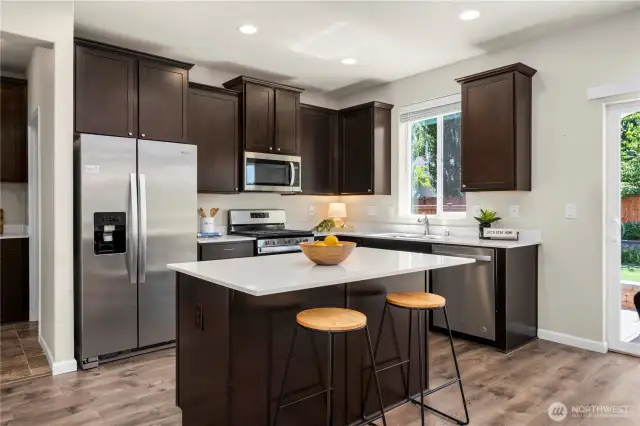 Belly up to a large island for breakfast or chatting with the cook during meal prep.