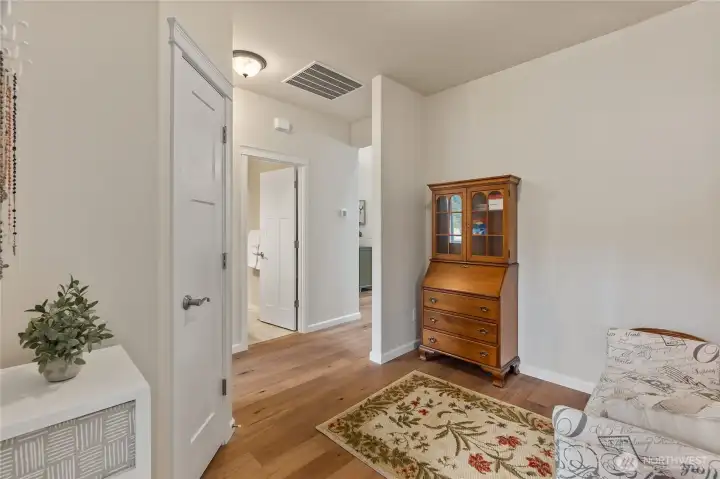 The main hallway opens to an ante-room and is a perfect spot to read or conduct personal correspondence.