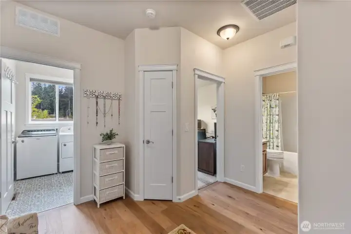 Another view from the ante room shows the laundry room to the left and the main bath to the right.