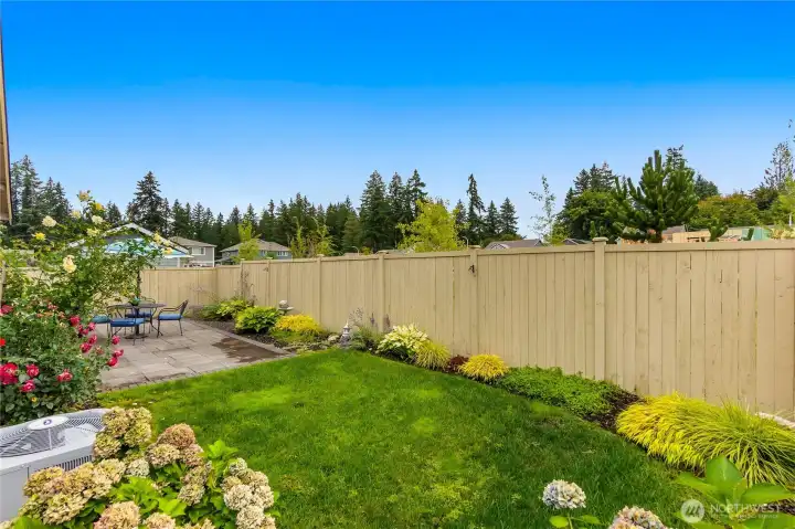 A built-in sprinkler system keeps the yard lush year-round.
