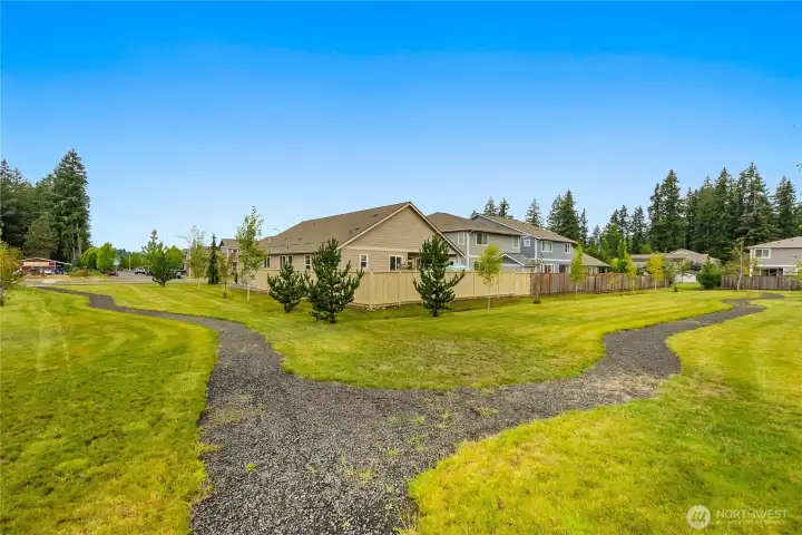 Paths and green space provide extra privacy for this lot.  There is open space to one side and at the rear of the lot making this a special place to call home.
