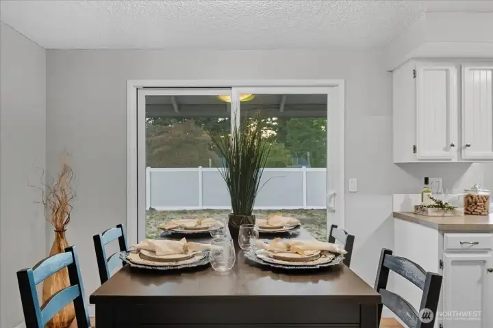 Dining Area w/ Sliding Door to Fenced Backyard