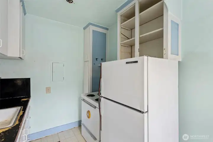 Vintage appliances and built-ins evoke a bygone era—ready for restoration or reinvention.