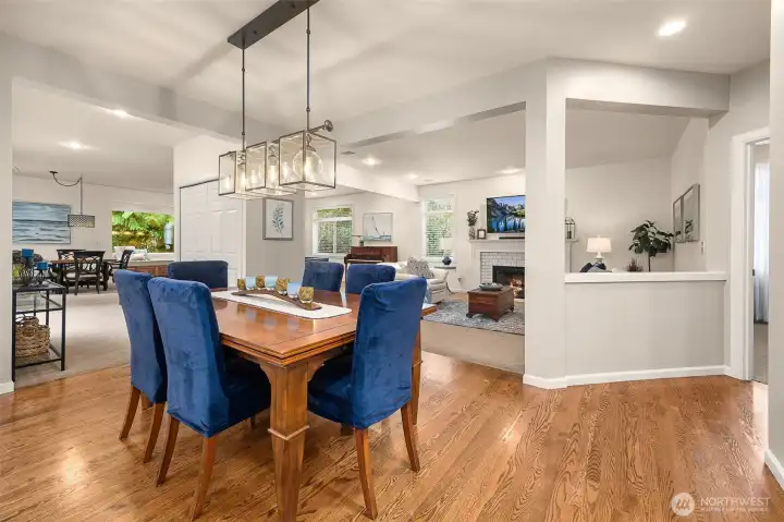 Flowing kitchen design opens to both the family room and added great room