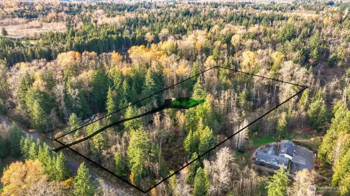 Property aerial with proposed driveway and conceptual boundary lines for reference