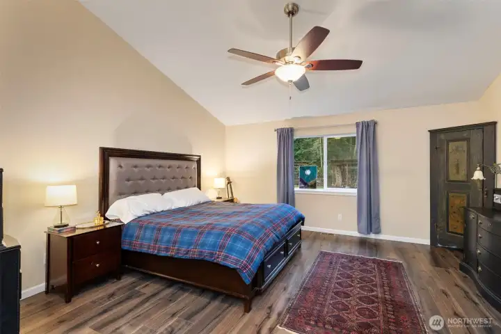 Primary suite fits a King bed and tons of furniture. Overlook the acreage out the back.