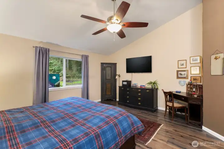 Vaulted ceilings in the primary make it feel even more grand!