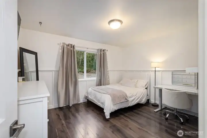 Other side of the house bedroom #2 with charming wainscoting.