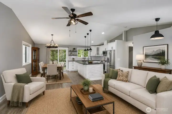 This AI staged photo demonstrates the the living room dining room and kitchen digitally staged. Sellers have just move their furniture from the home.