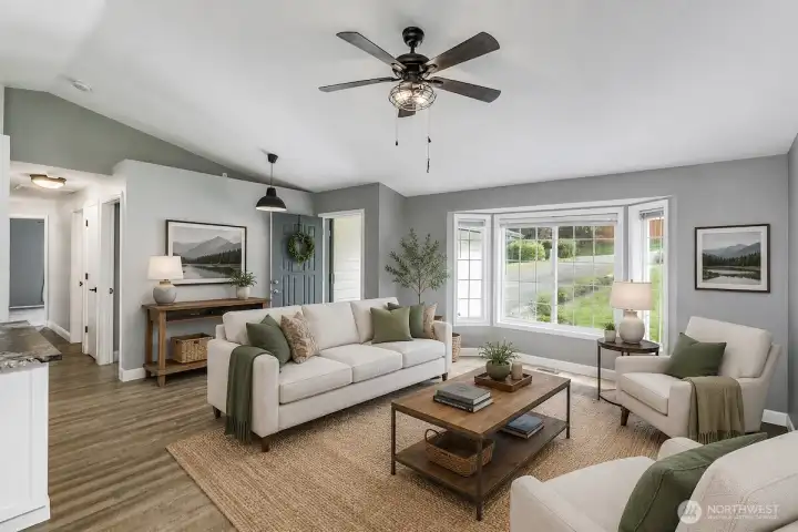 This AI digitally staged photo demonstrates the living room and entry. Sellers have just move their furniture from the home.