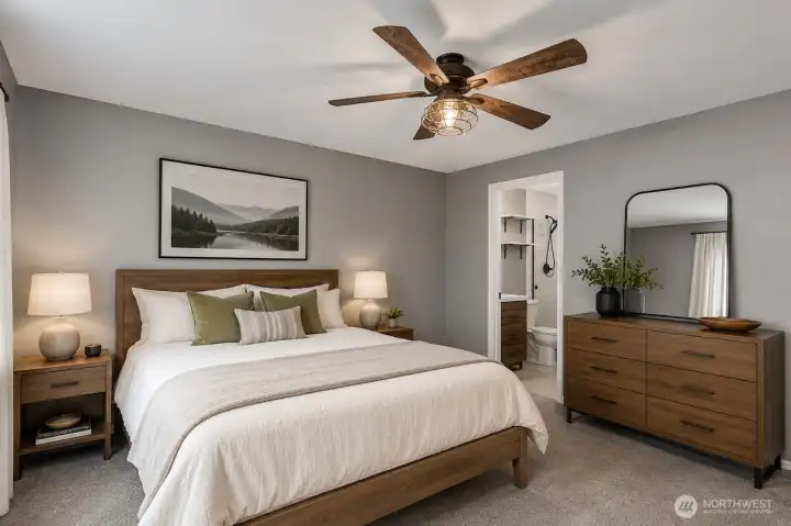 This AI digitally staged photo demonstrates the primary bedroom. Sellers have just move their furniture from the home.