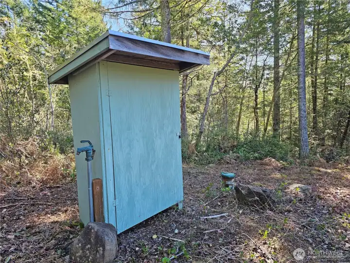 The housing for the well pump electronics is on the middle tier. Another large homesite and views for days!