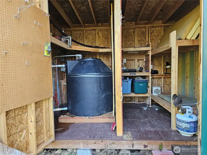Water system to the right. This is the holding tank for the well, with a bob installed to keep it full without burning out your pump. It's plug and play!
