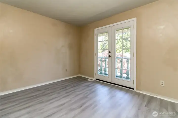 Bedroom with front deck access. Bedroom with front deck access.