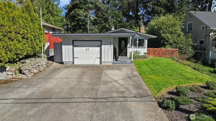 Room for multiple cars to park in the driveway.