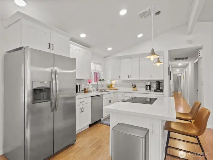 Updated kitchen with stainless steel appliances that all stay with the home.