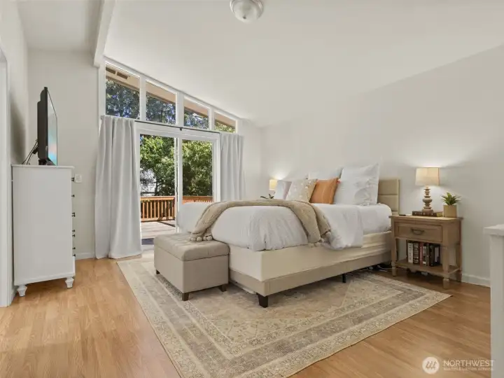 Spacious primary suite with vaulted ceilings.