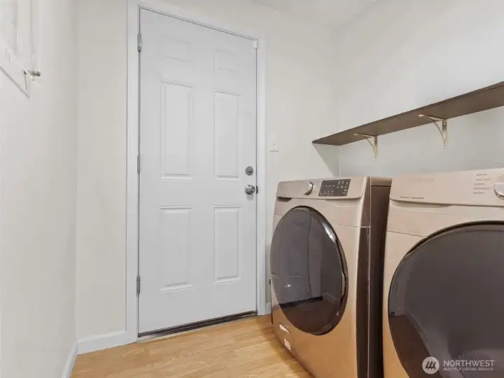 Laundry room with access to outside.
