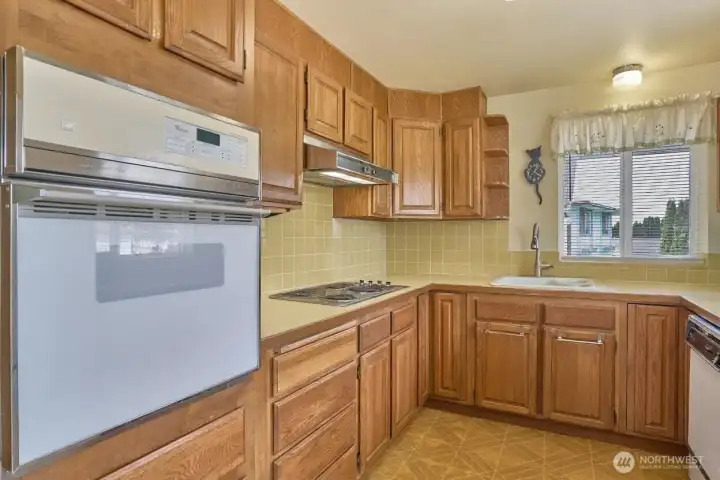 Chef's Kitchen with Tile Backsplash.