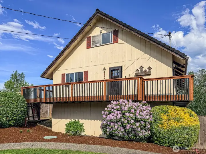 2024 Installed wrap around deck with beautiful landscaping