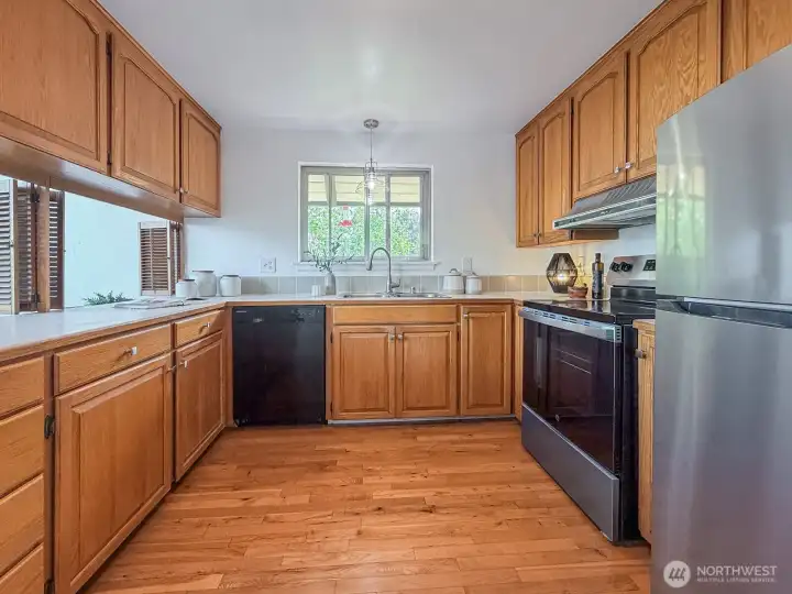 Kitchen with new stove, lighting.