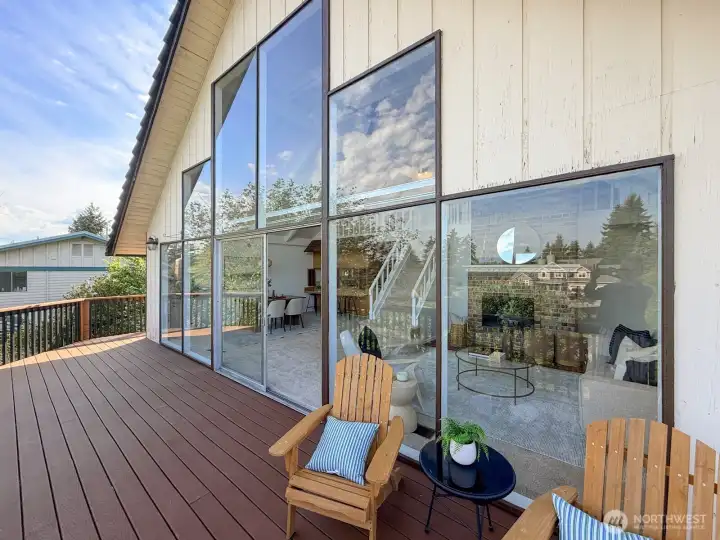 Expansive windows and back porch  for grilling, relaxing or morning coffee