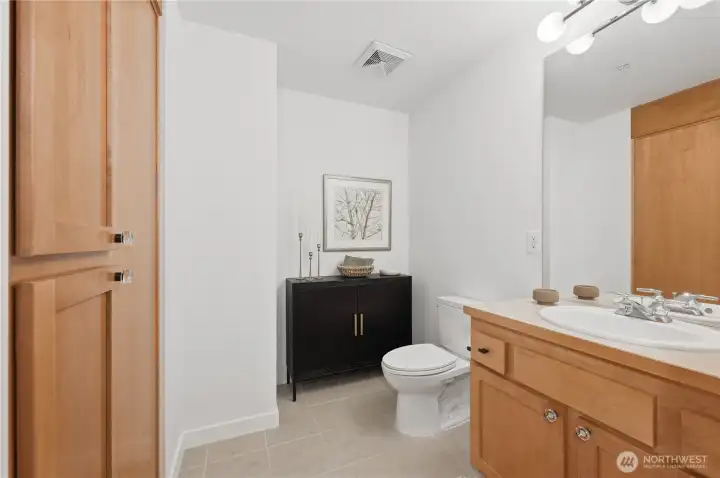 An additional powder room off the entry for entertaining guests. An additional powder room off the entry for entertaining guests.