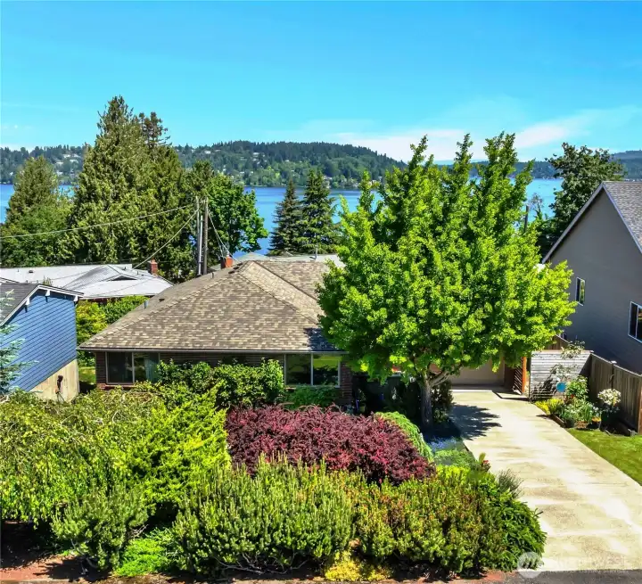 Perched above the neighborhood with sweeping Northwest vistas.