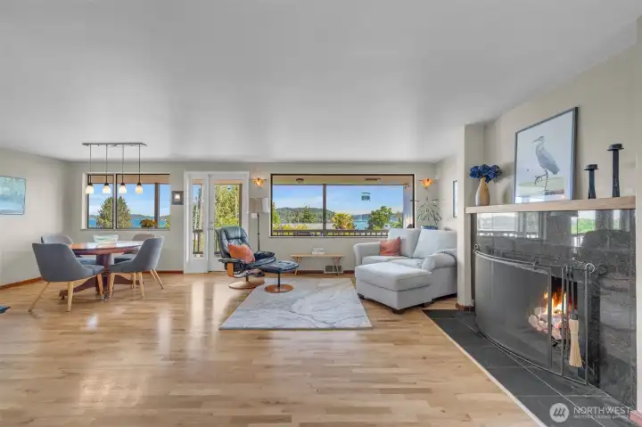 Light-filled living and dining room with stunning lake and city views.