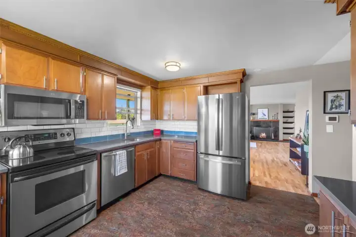 Plenty of space for cooking and gathering. Stainless steel appliances provide modern convenience.
