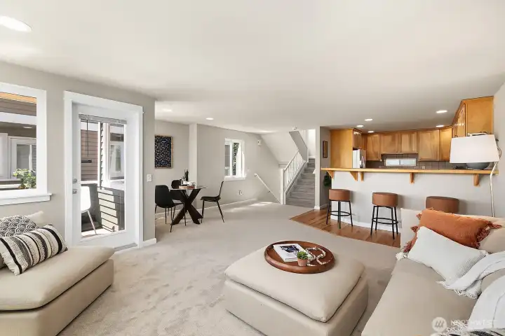 Large main living area with options for dining. This also shows proximity to the kitchen