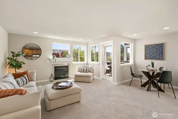 Another angle of the living area shows walls of windows for lots of natural light plus access to the deck.