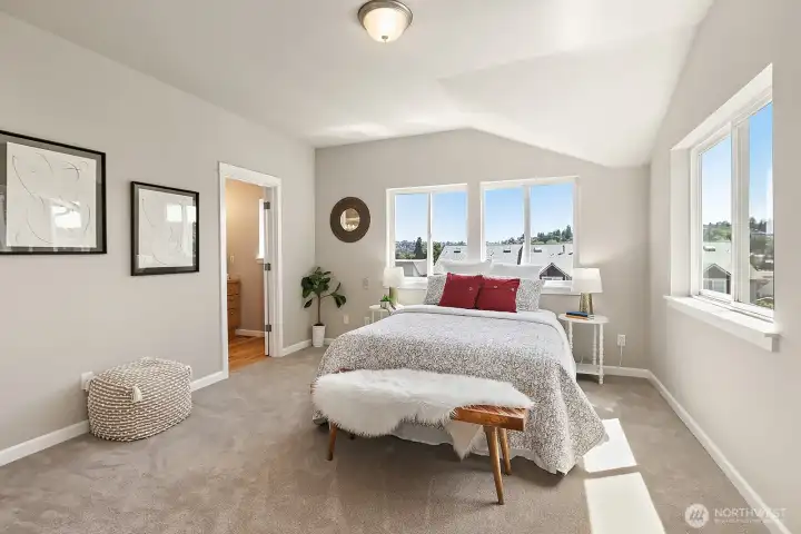 The upper level has a spacious primary en-suite with private bath and walk-in closet
