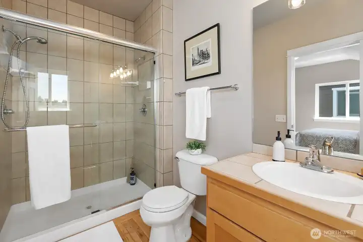 The bath off of the primary has a huge shower with dual shower heads