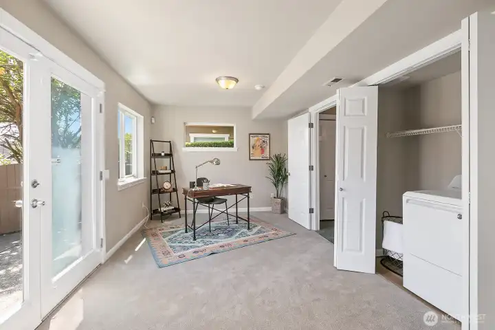 Notice the convenient laundry area in this space that fits full size washer & dryer