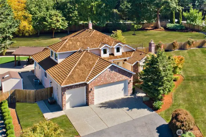 Front view of beautiful two story home on a shy acre at the Highlands of Cedar River.