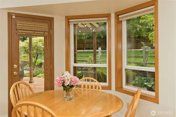 Dining area with beautiful windows and door to the deck.