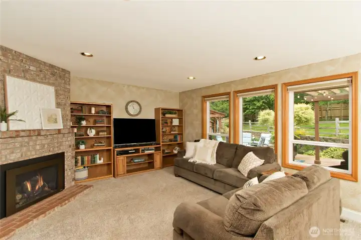 Living room next to the kitchen, full of light and views to the private back yard.