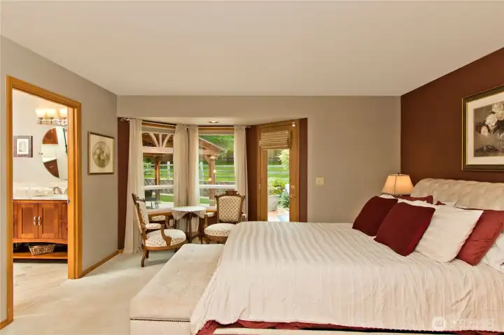 Spacious primary bedroom on the main floor, with private access to the gorgous back yard deck.