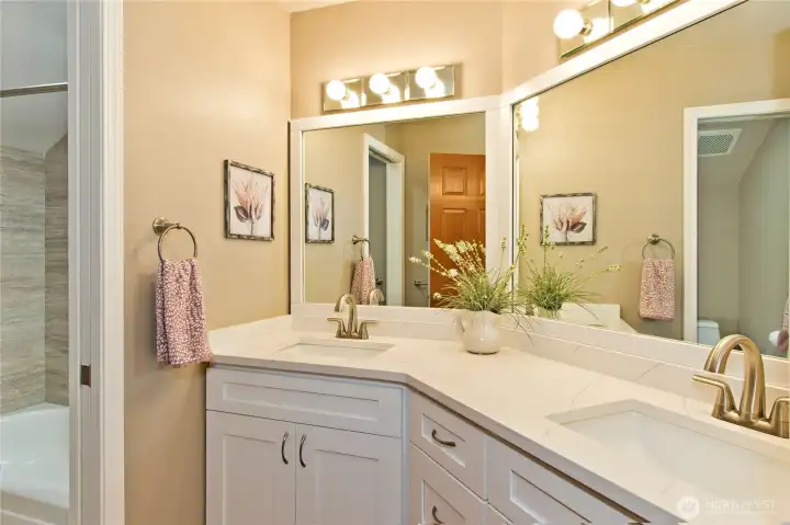 Upstairs bathroom with tiled shower.
