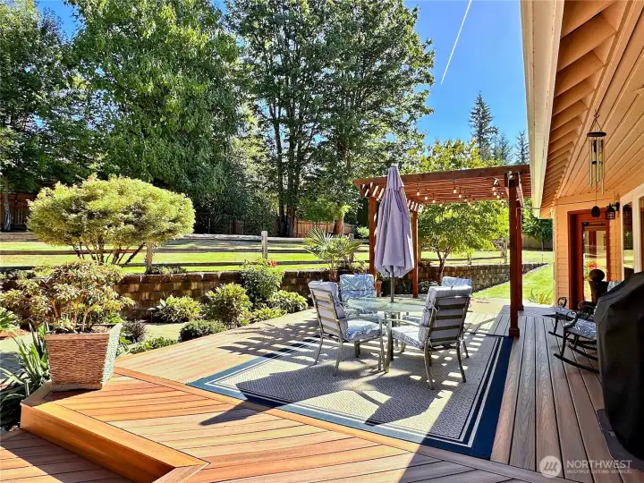 Expansive tiered deck in back yard.