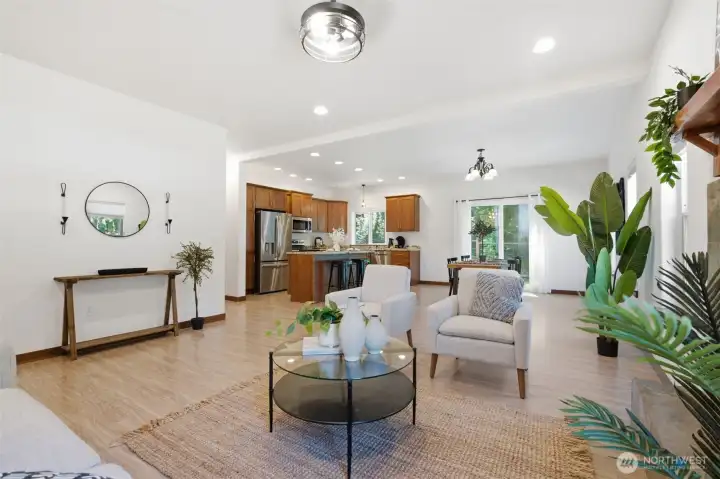 The living room flows seamlessly into the kitchen and dining area