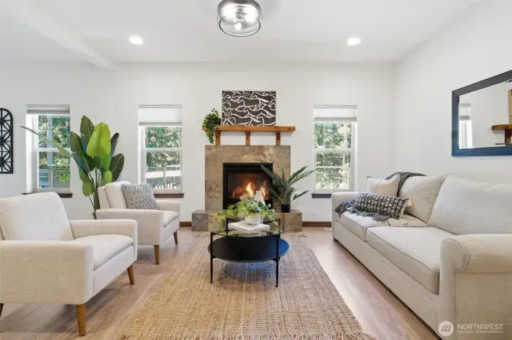 Enjoy so much natural light, tall ceilings, and a propane fireplace