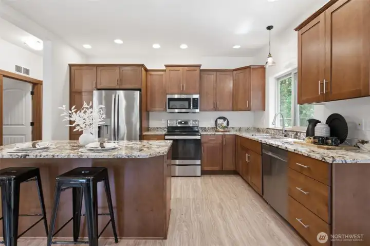 Beautiful granite counter tops and stainless steel appliances