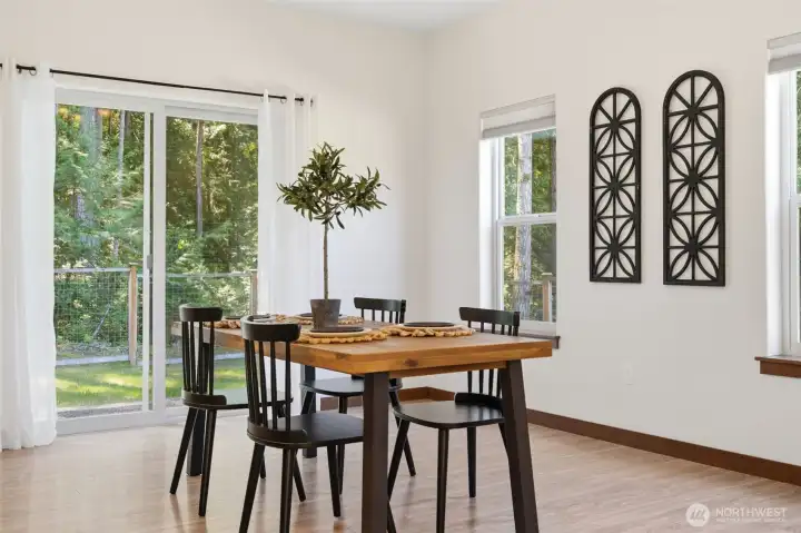 Dining room leads to fully fenced back yard