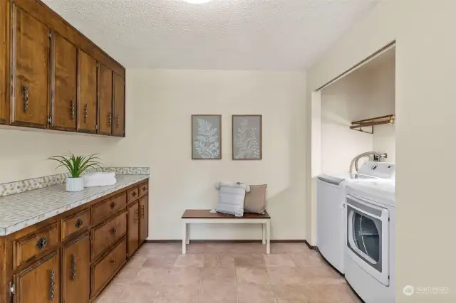 Spacious laundry room with ample storage.