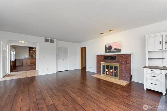 Living room with entrance to the dining room.