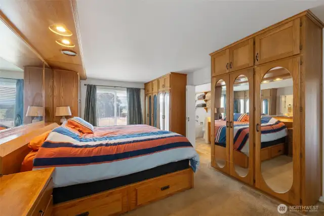Primary bedroom with built-ins and views of the Olympics